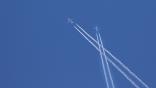 Two aircraft leave behind contrails