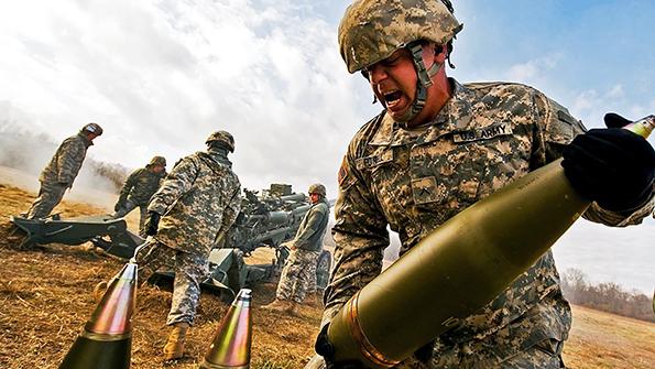 soldier carrying artillery shell