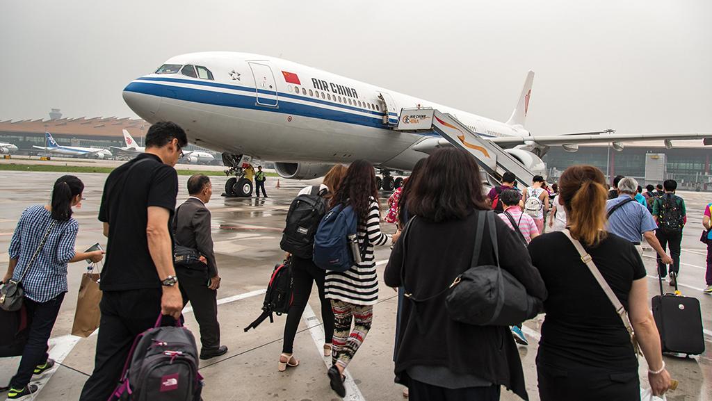 passengers boarding Air China aircraft