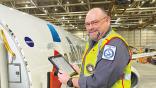 American Airlines technician with tablet